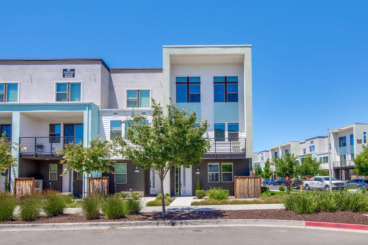 6656 Stealth Loop San Jose, CA 95119 - Photo 5 of 50 a front view of residential houses with yard