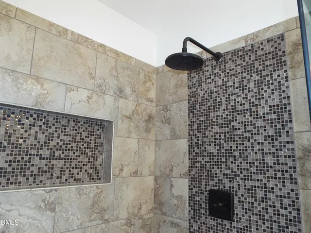 an aerial view of a house with roof deck and outdoor seating