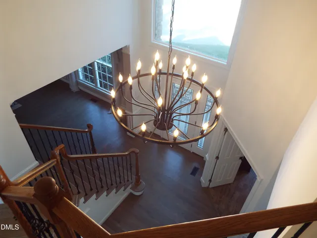 a view of staircase with railing and stairs