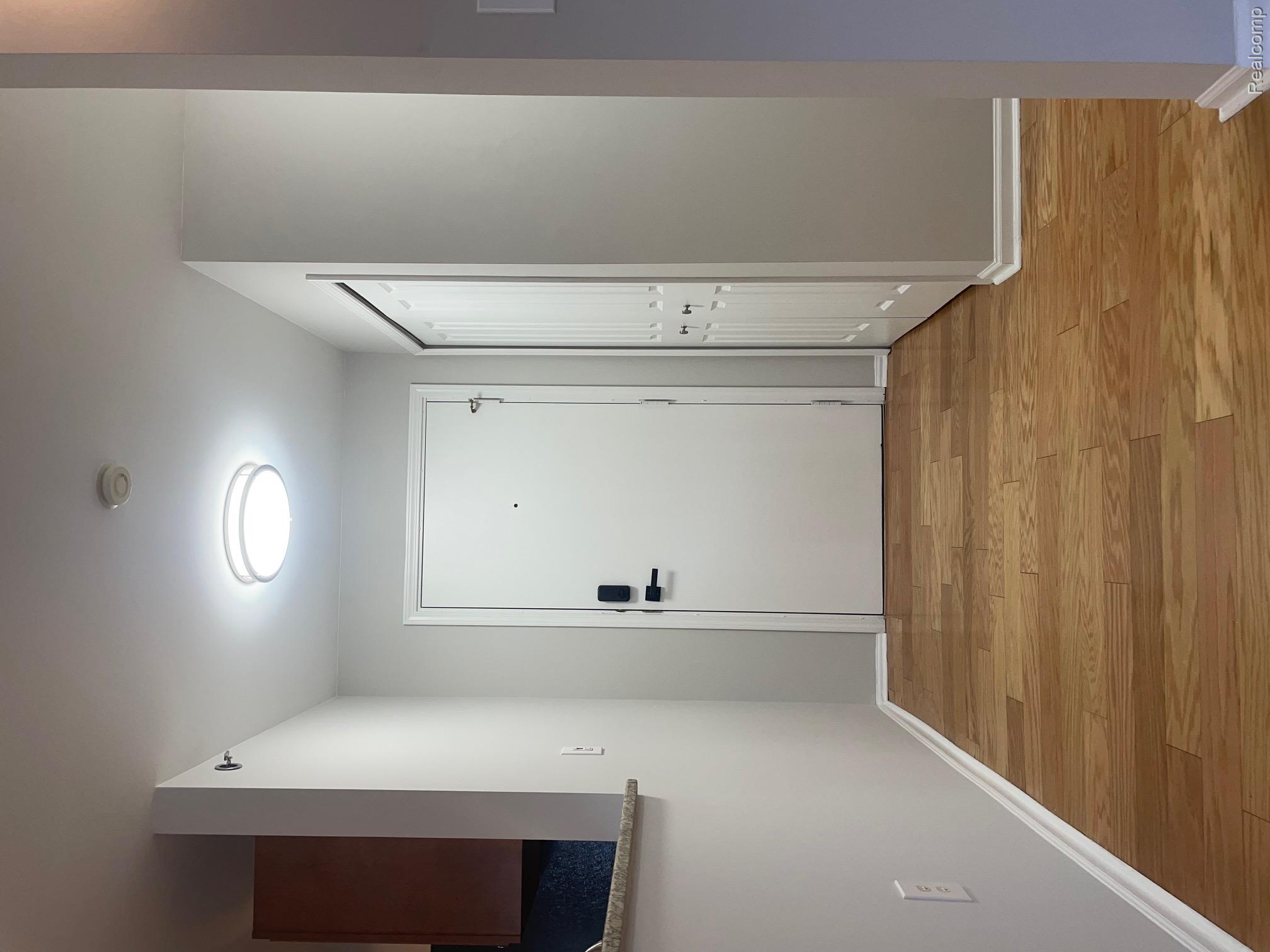 2727 East Maple Road Birmingham, MI 48009 - Photo 19 of 29 Wood-finish flooring with white trim