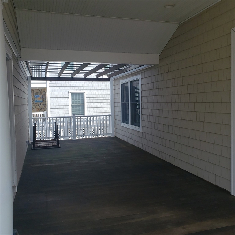 398 North End, Unit B Salisbury, MA 01952 - Photo 10 of 13 a view of an empty room with wooden floor and a window