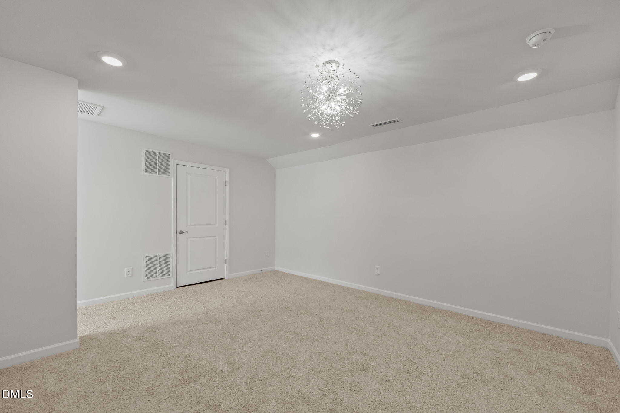 1639 Abberly Place Graham, NC 27253 - Photo 22 of 43 an empty room with a chandelier fan and windows
