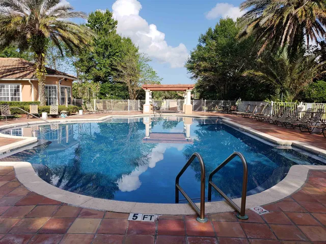 a room with pool table and a window