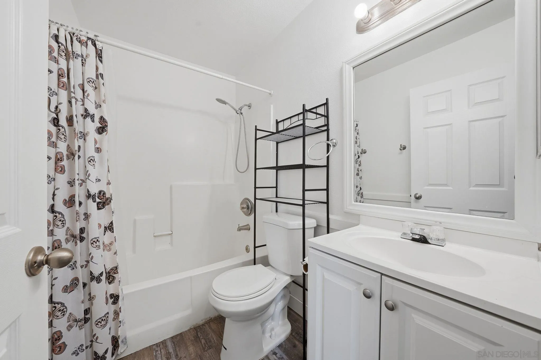 293 Sycamore Road, Unit 15 San Ysidro, CA 92173 - Photo 20 of 25 a bathroom with a sink toilet and shower