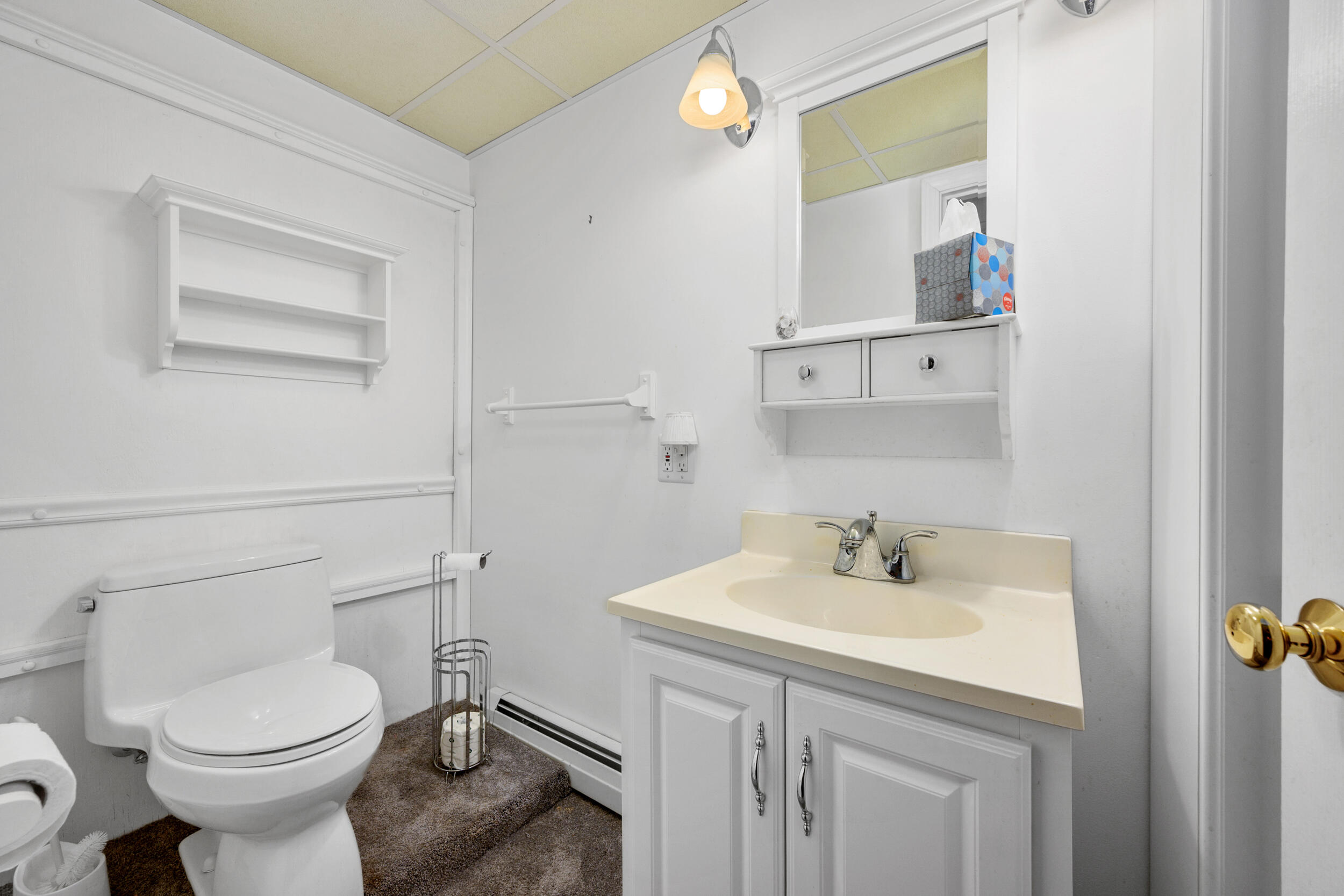 136 Sheaffer Road Centerville, MA 02632 - Photo 28 of 44 a bathroom with a sink toilet and vanity