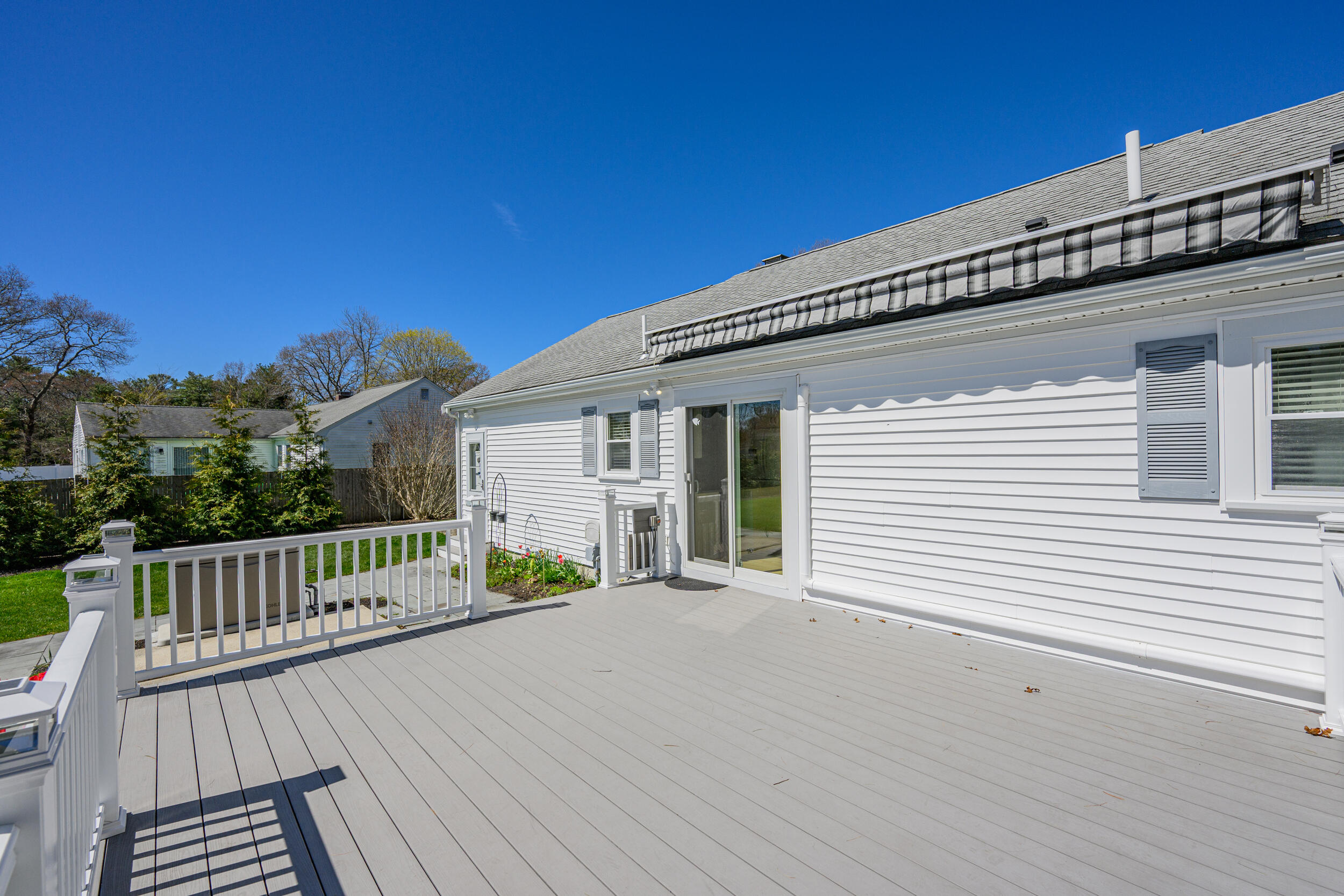 136 Sheaffer Road Centerville, MA 02632 - Photo 31 of 44 a view of a house with a wooden deck