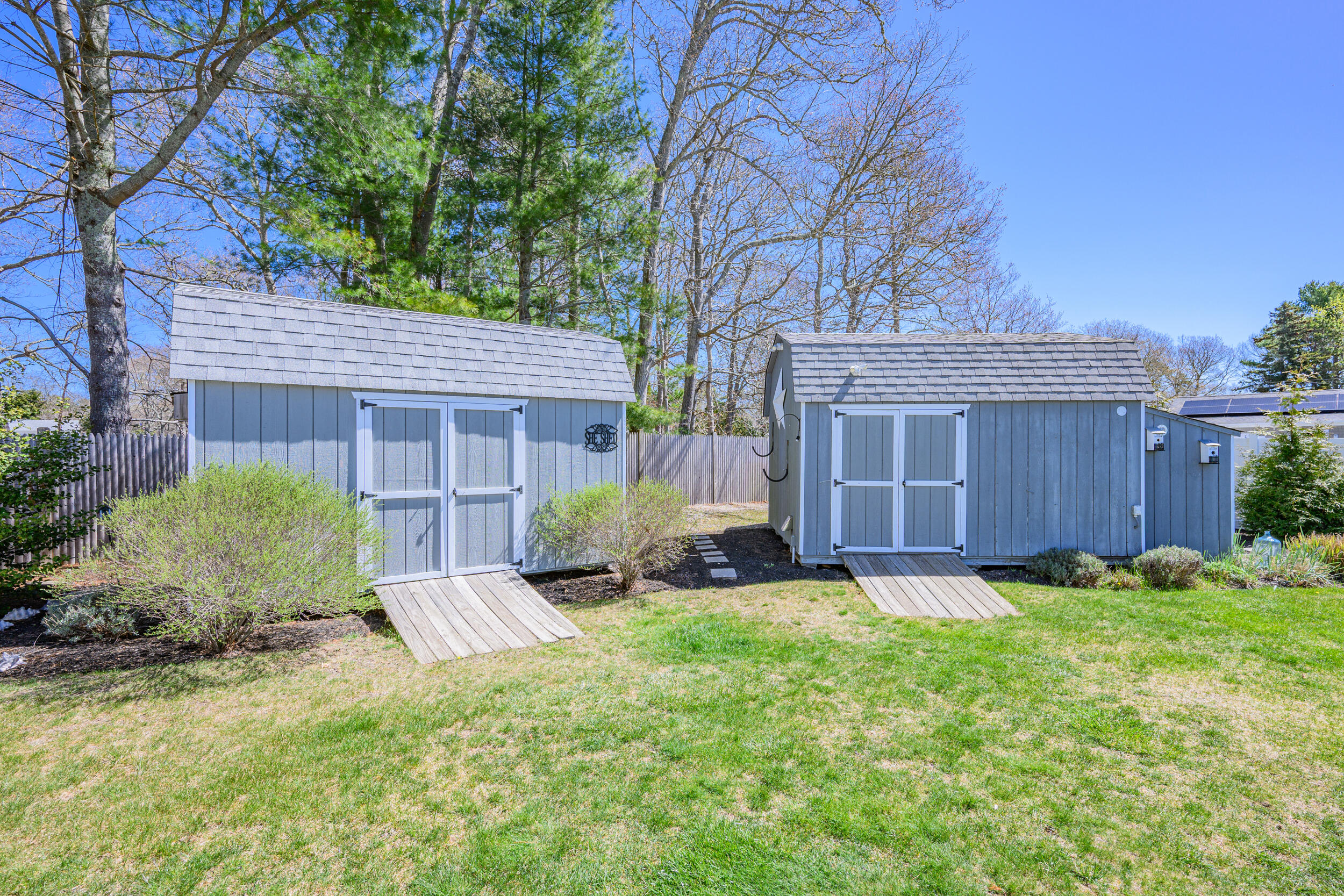 136 Sheaffer Road Centerville, MA 02632 - Photo 39 of 44 a view of a house with a yard and pathway