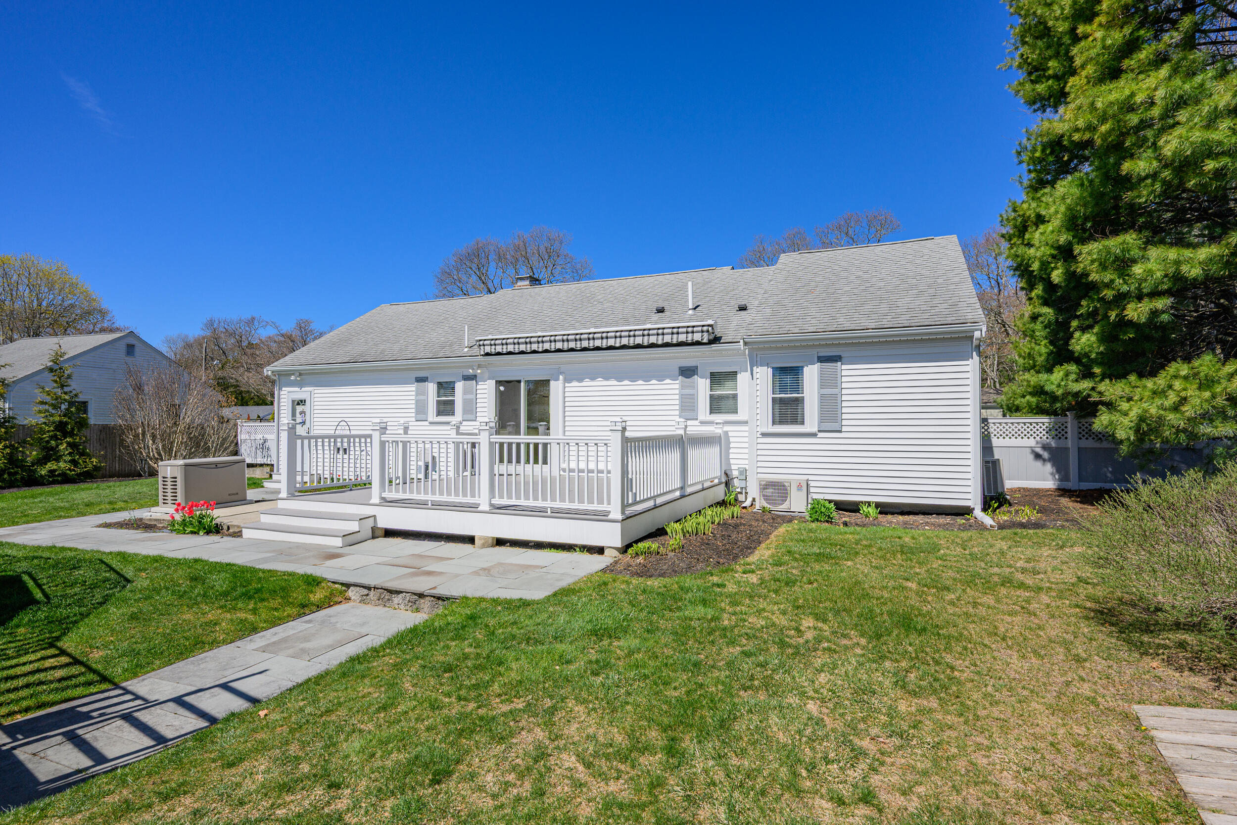 136 Sheaffer Road Centerville, MA 02632 - Photo 43 of 44 a view of a house with a yard and sitting area