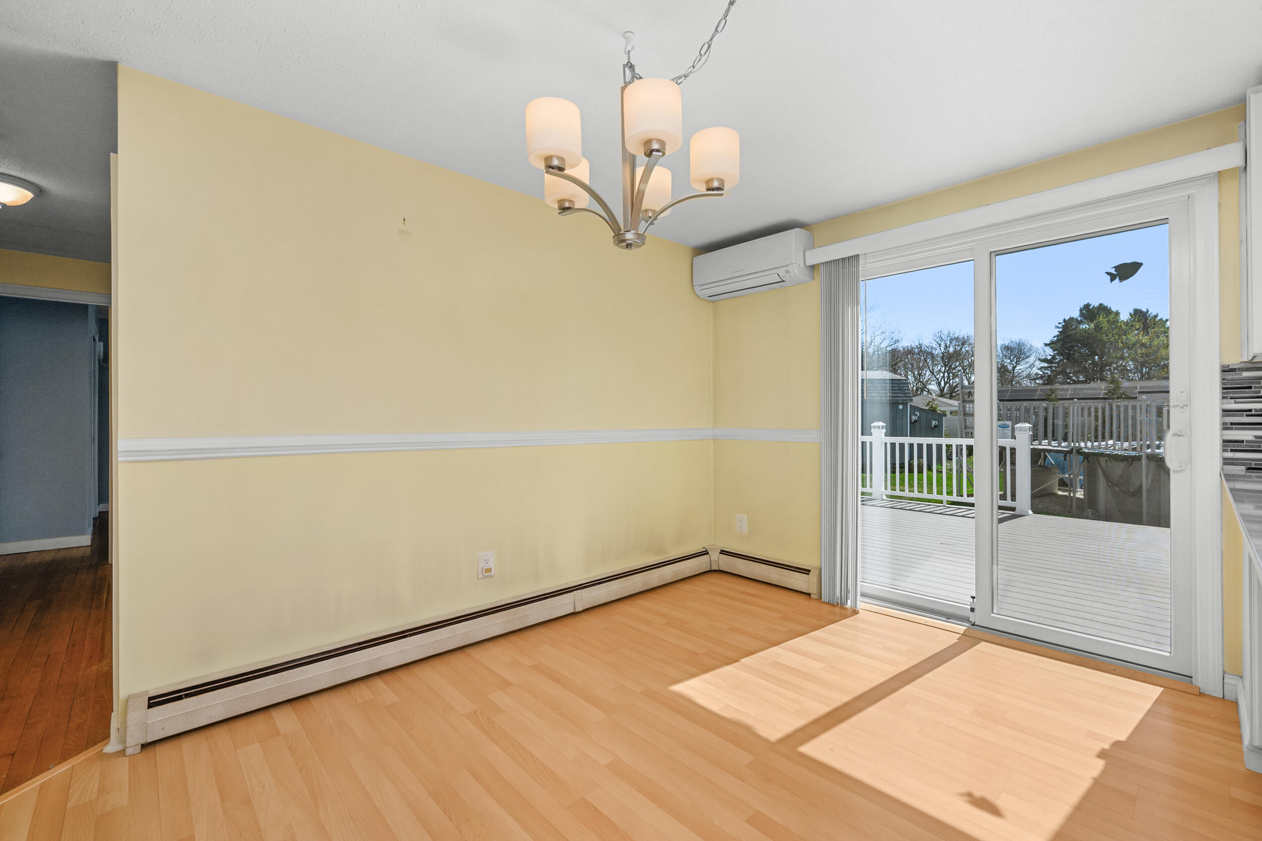 136 Sheaffer Road Centerville, MA 02632 - Photo 9 of 44 a view of a room with wooden floor and windows