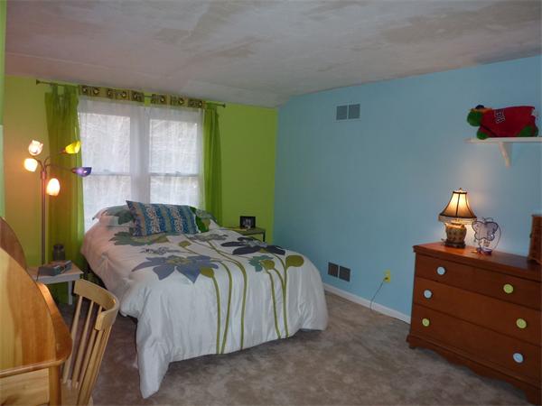 8 Nehemiah Road Shirley, MA 01464 - Photo 17 of 19 a bed sitting in a bedroom next to a window