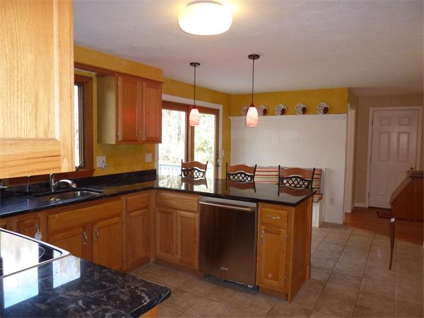 8 Nehemiah Road Shirley, MA 01464 - Photo 4 of 19 a kitchen that has a sink and a stove