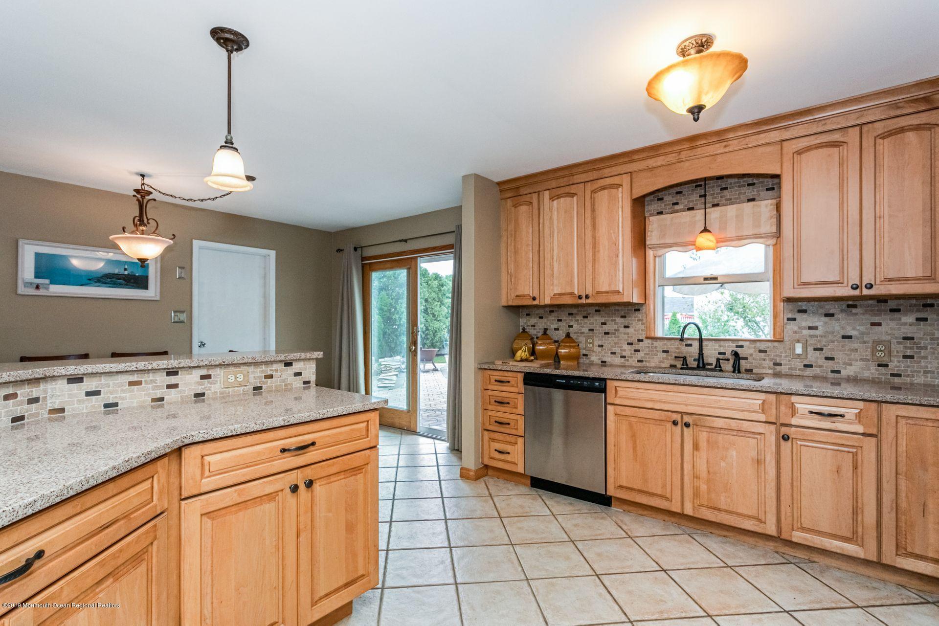 132 Mizzen Road Brick, NJ 08723 - Photo 11 of 41 a kitchen with granite countertop a sink and cabinets