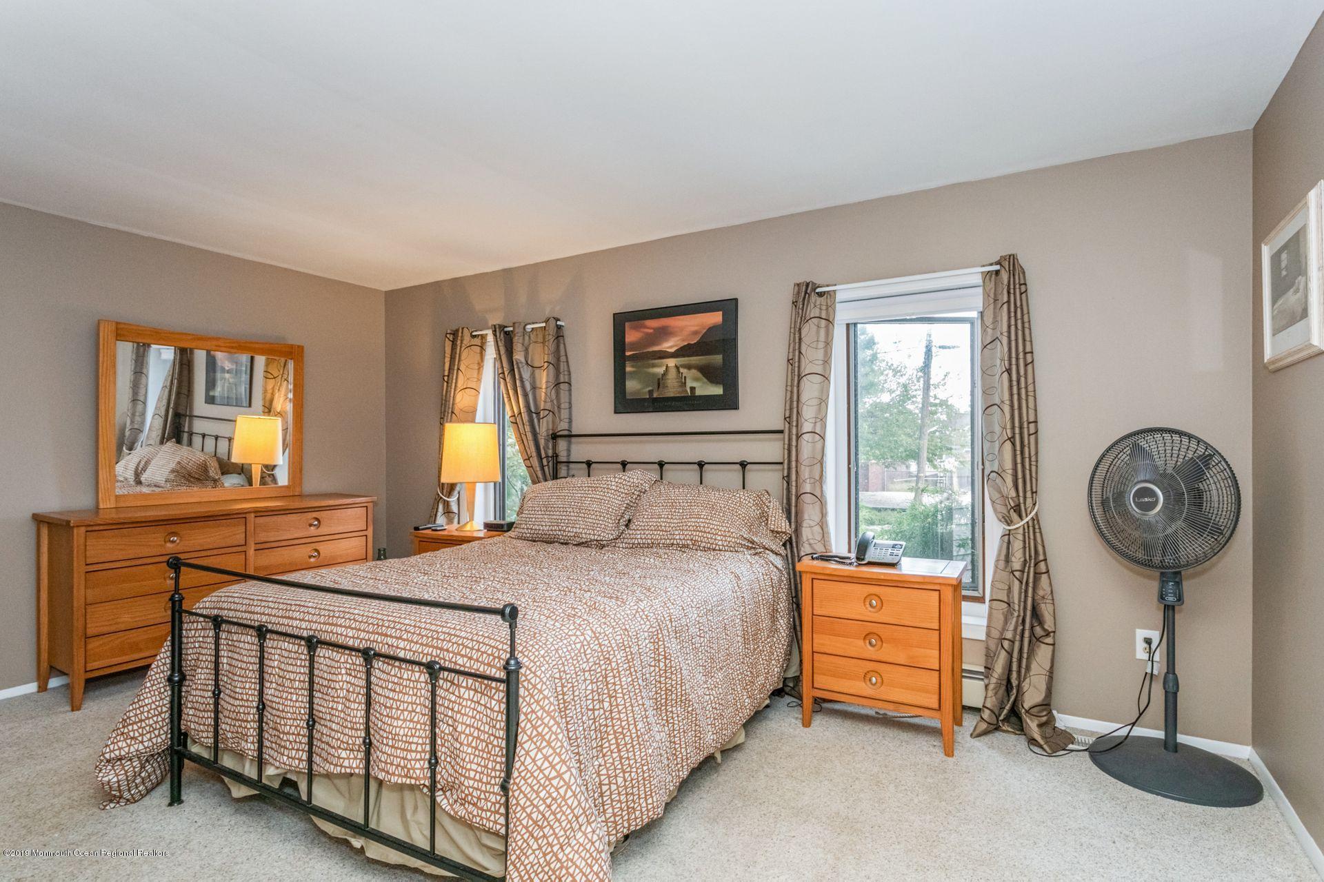 132 Mizzen Road Brick, NJ 08723 - Photo 14 of 41 a bedroom with a bed a dresser and next to a window
