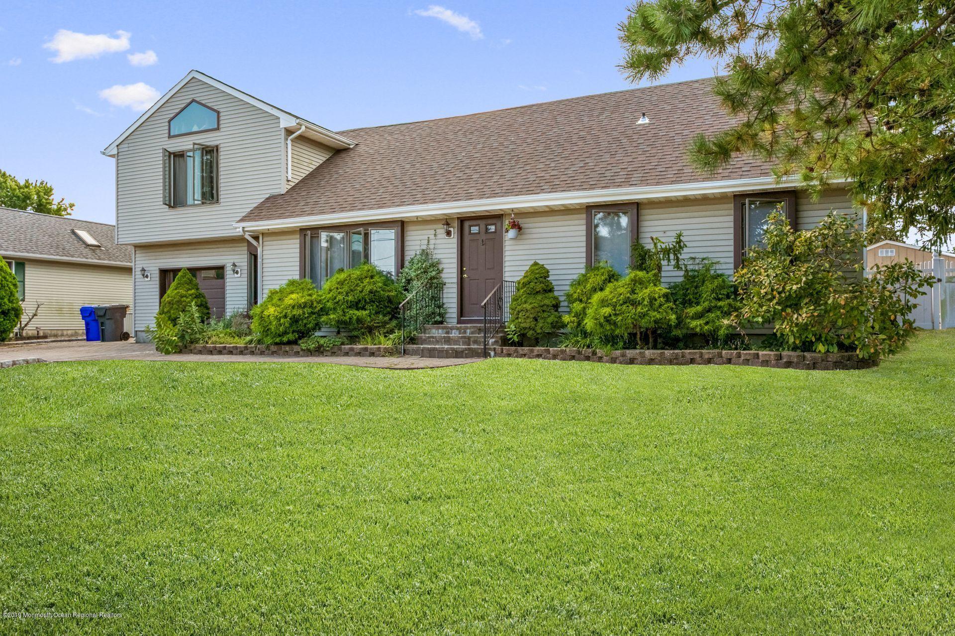 132 Mizzen Road Brick, NJ 08723 - Photo 3 of 41 a front view of a house with a yard