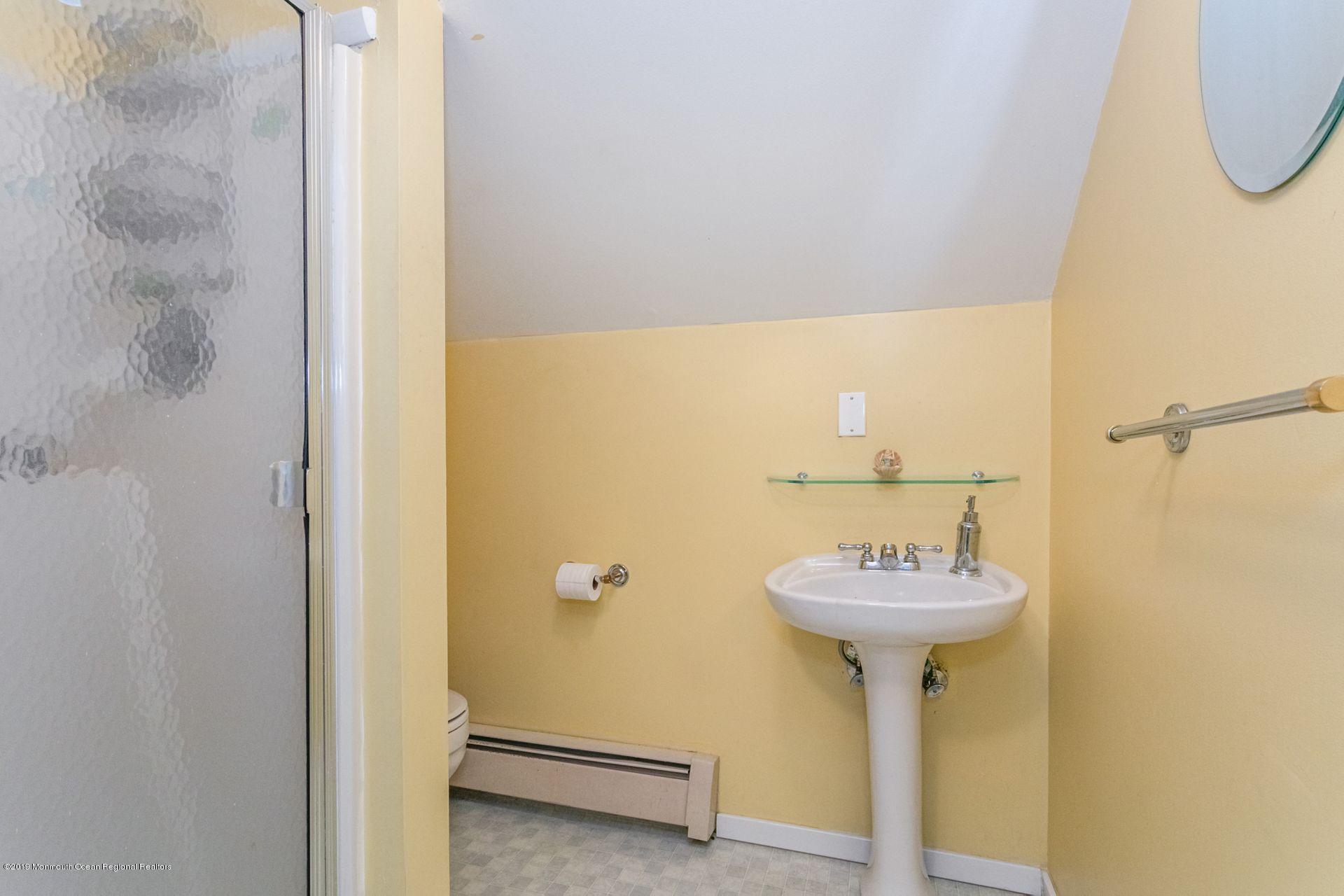 132 Mizzen Road Brick, NJ 08723 - Photo 21 of 41 a bathroom with a sink and a mirror