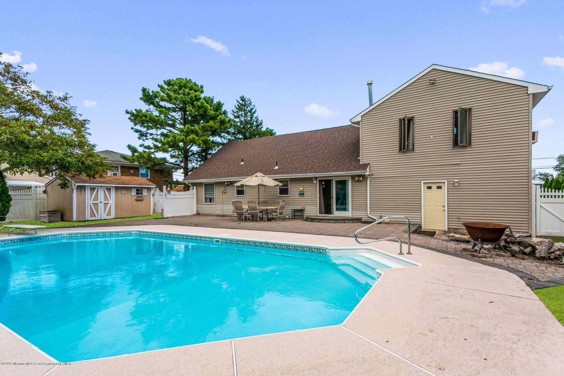 132 Mizzen Road Brick, NJ 08723 - Photo 28 of 41 a front view of a house with garden