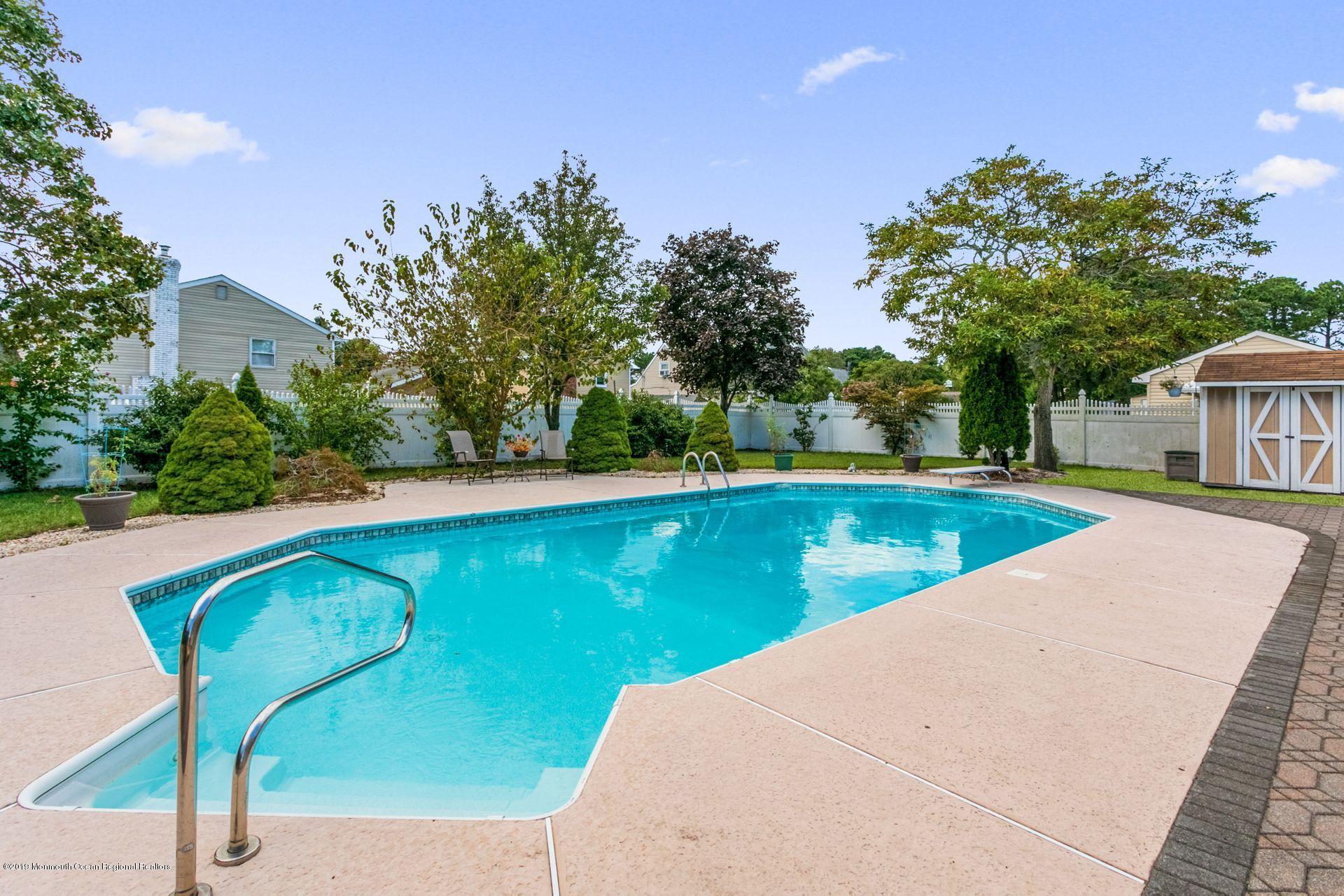 132 Mizzen Road Brick, NJ 08723 - Photo 29 of 41 an outdoor view with swimming pool and seating space