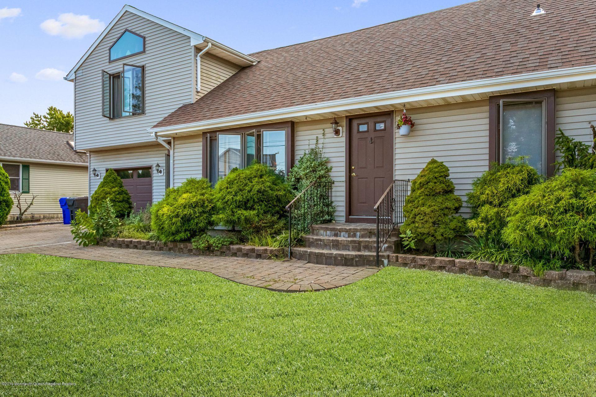 132 Mizzen Road Brick, NJ 08723 - Photo 4 of 41 a front view of a house with a garden