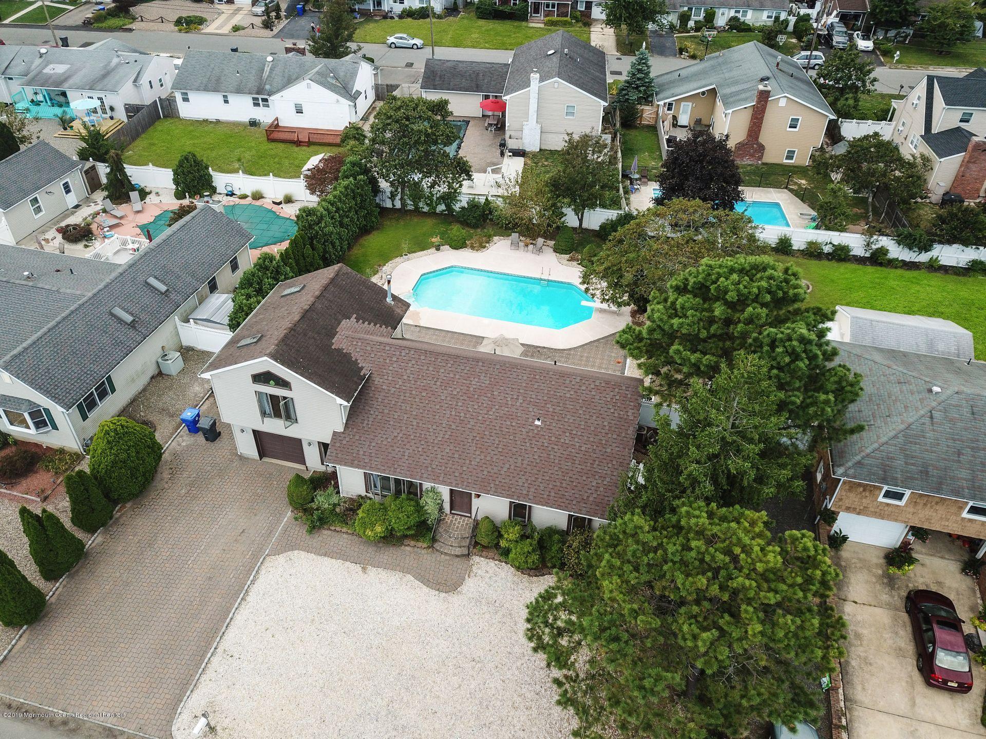 132 Mizzen Road Brick, NJ 08723 - Photo 32 of 41 an aerial view of a house with a garden and a yard