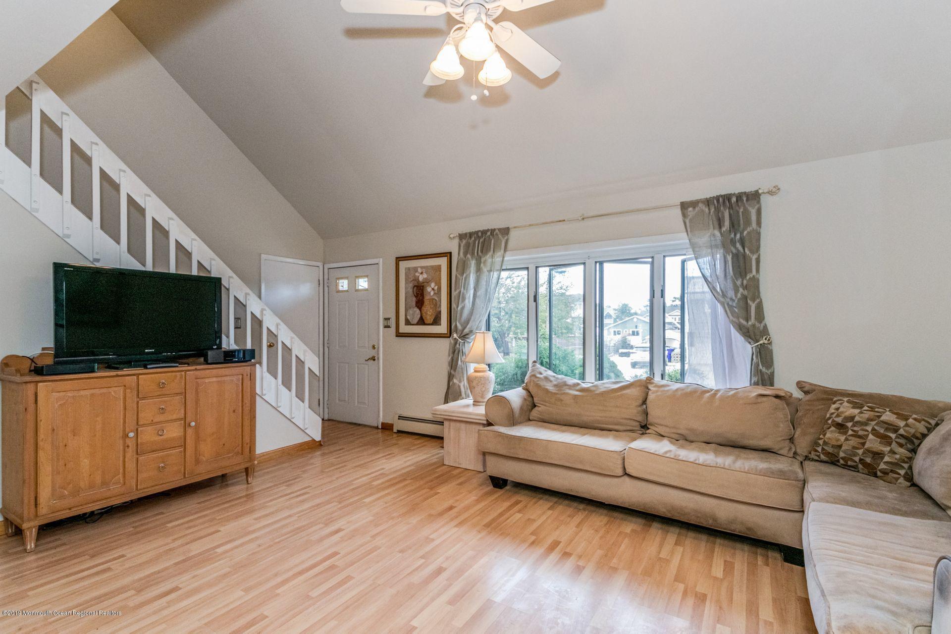 132 Mizzen Road Brick, NJ 08723 - Photo 5 of 41 a living room with furniture and a flat screen tv