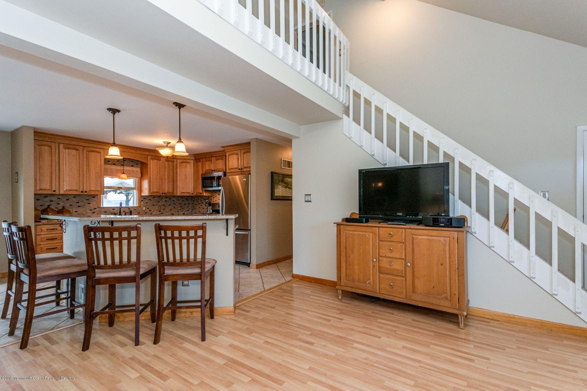 132 Mizzen Road Brick, NJ 08723 - Photo 7 of 41 a view of a livingroom with furniture and a flat screen tv