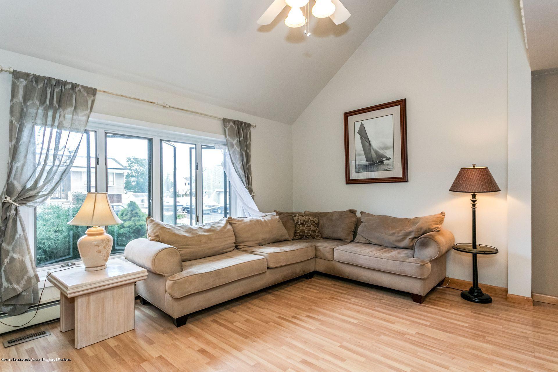 132 Mizzen Road Brick, NJ 08723 - Photo 8 of 41 a living room with furniture and a large window
