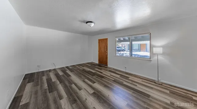 a kitchen with refrigerator and cabinets