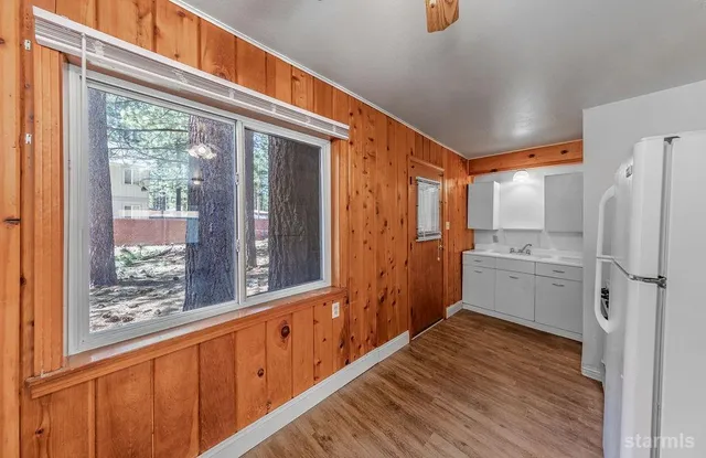 an empty room with windows and painted walls