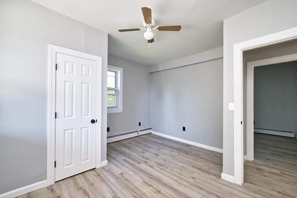 54 Grinnell Street, Unit 1 Fall River, MA 02721 - Photo 6 of 7 wooden floor in an empty room with a window
