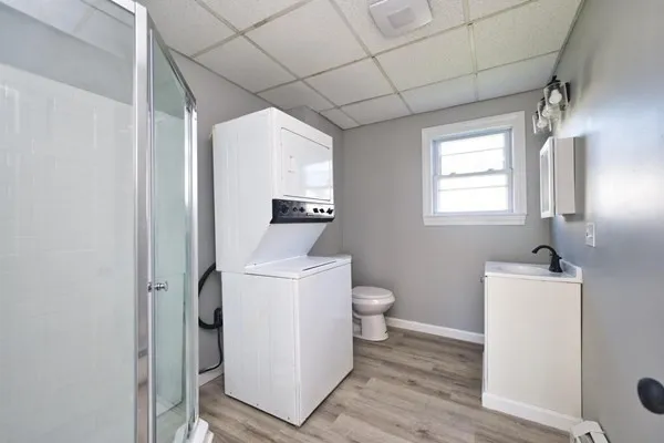 a bathroom with a toilet sink and tub