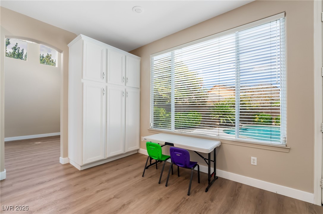 2392 Rainswept Avenue Henderson, NV 89052 - Photo 18 of 49 Office area featuring light wood-type flooring and a wealth of natural light