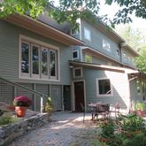 a front view of a house with a garden