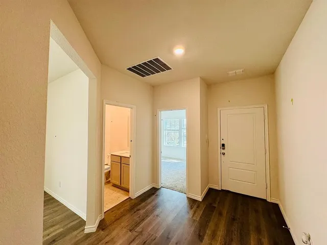 a view of a big room with carpet