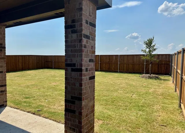 a house view with a garden space
