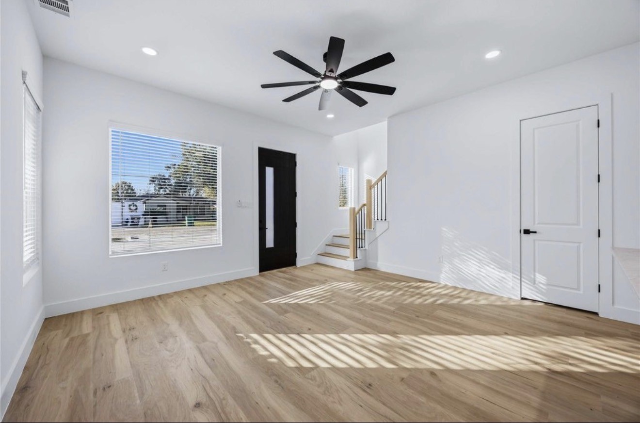 3923 Aledo Street, Unit B Houston, TX 77051 - Photo 3 of 12 a view of a livingroom with a ceiling fan and wooden floor