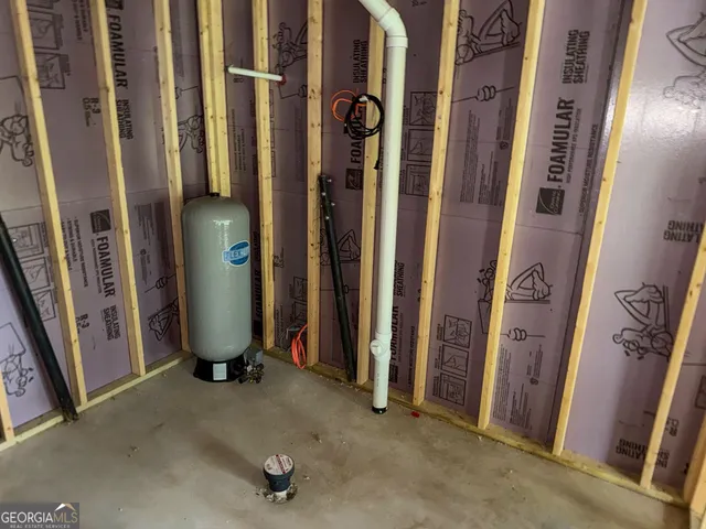 a view of a porch with a table and chairs