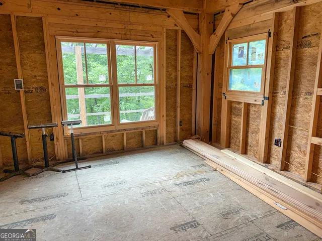 a view of a chairs with a small yard