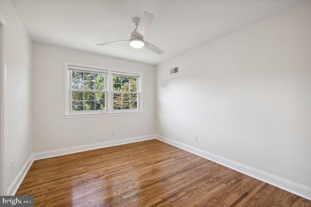 11810 Coldstream Drive Potomac, MD 20854 - Photo 13 of 30 an empty room with wooden floor and windows