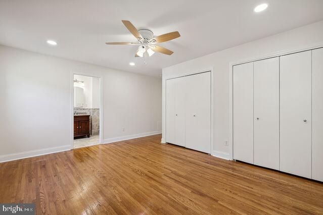 11810 Coldstream Drive Potomac, MD 20854 - Photo 15 of 30 an empty room with wooden floor fan and windows