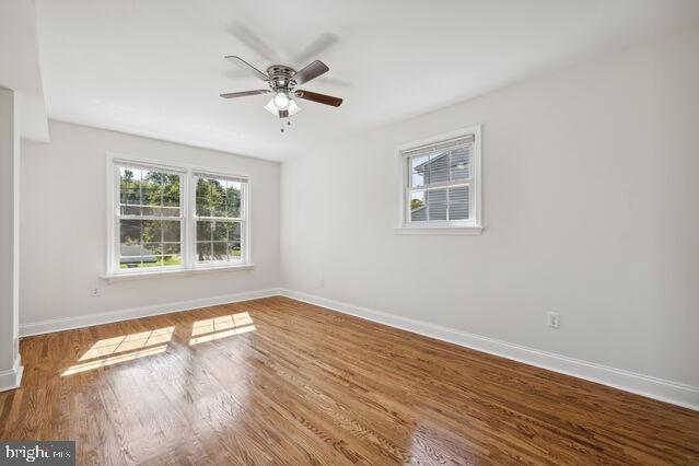 11810 Coldstream Drive Potomac, MD 20854 - Photo 17 of 30 a view of an empty room with wooden floor and a window