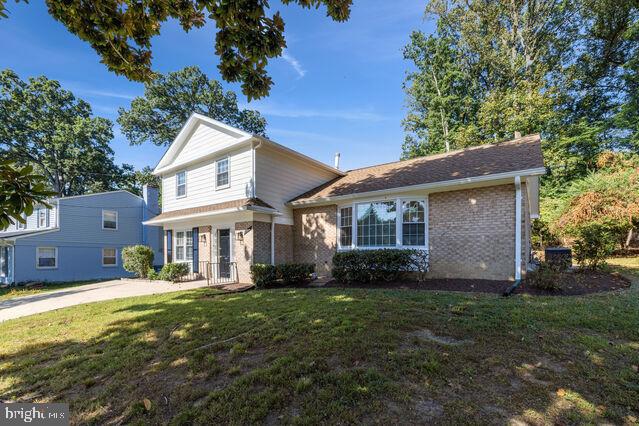 11810 Coldstream Drive Potomac, MD 20854 - Photo 3 of 30 a front view of a house with a yard