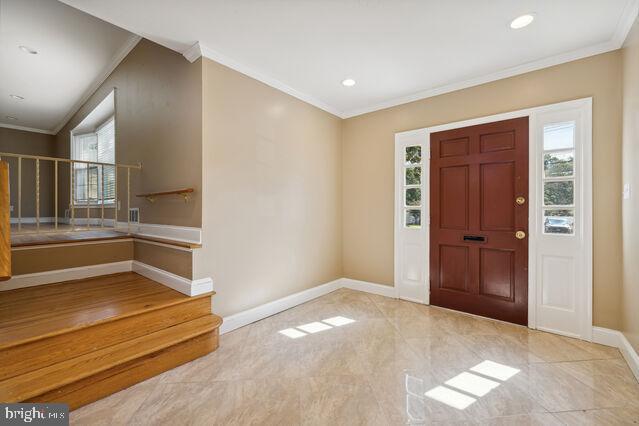 11810 Coldstream Drive Potomac, MD 20854 - Photo 4 of 30 an empty room with windows and entrance