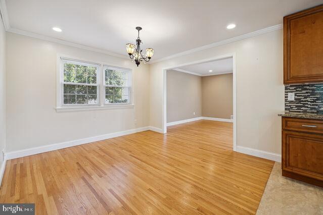 11810 Coldstream Drive Potomac, MD 20854 - Photo 6 of 30 a view of an empty room with wooden floor and a window
