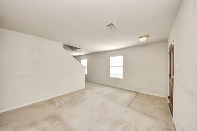 a view of a house with a backyard and a patio