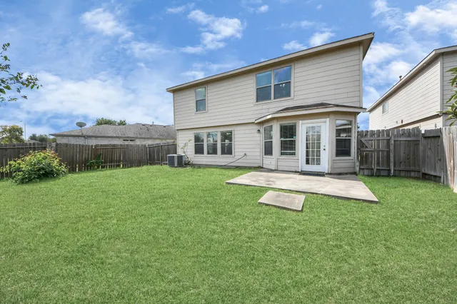 an empty room with a empty space and a ceiling fan