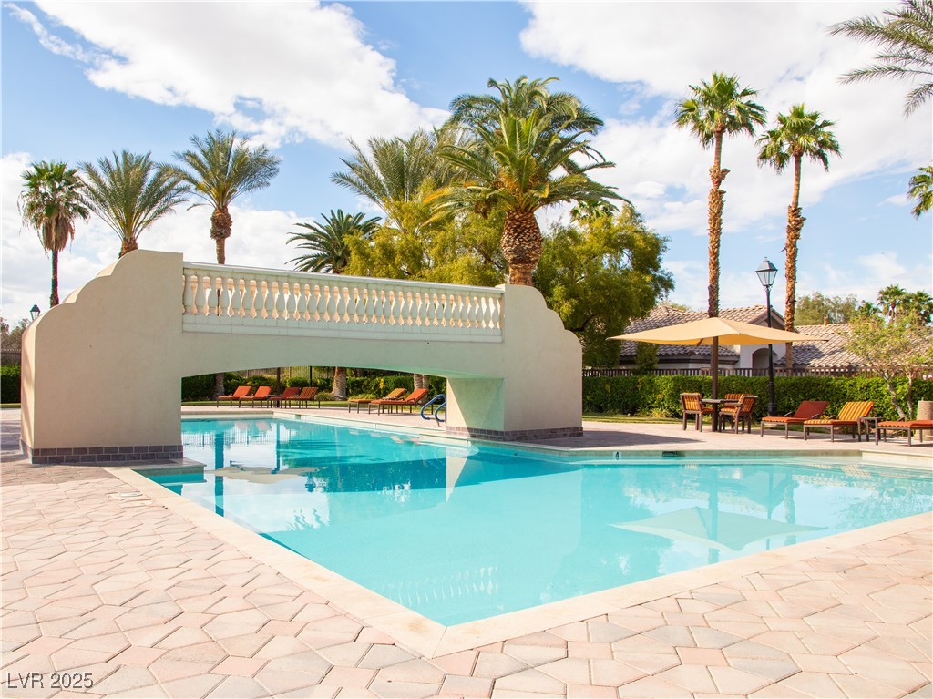 2050 West Warm Springs Road, Unit 411 Henderson, NV 89014 - Photo 21 of 30 Pool with fence and a patio area