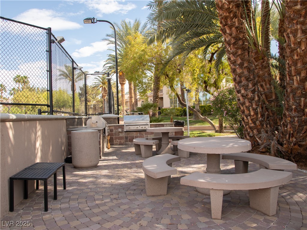 2050 West Warm Springs Road, Unit 411 Henderson, NV 89014 - Photo 23 of 30 Surrounding community featuring area for grilling and a patio area