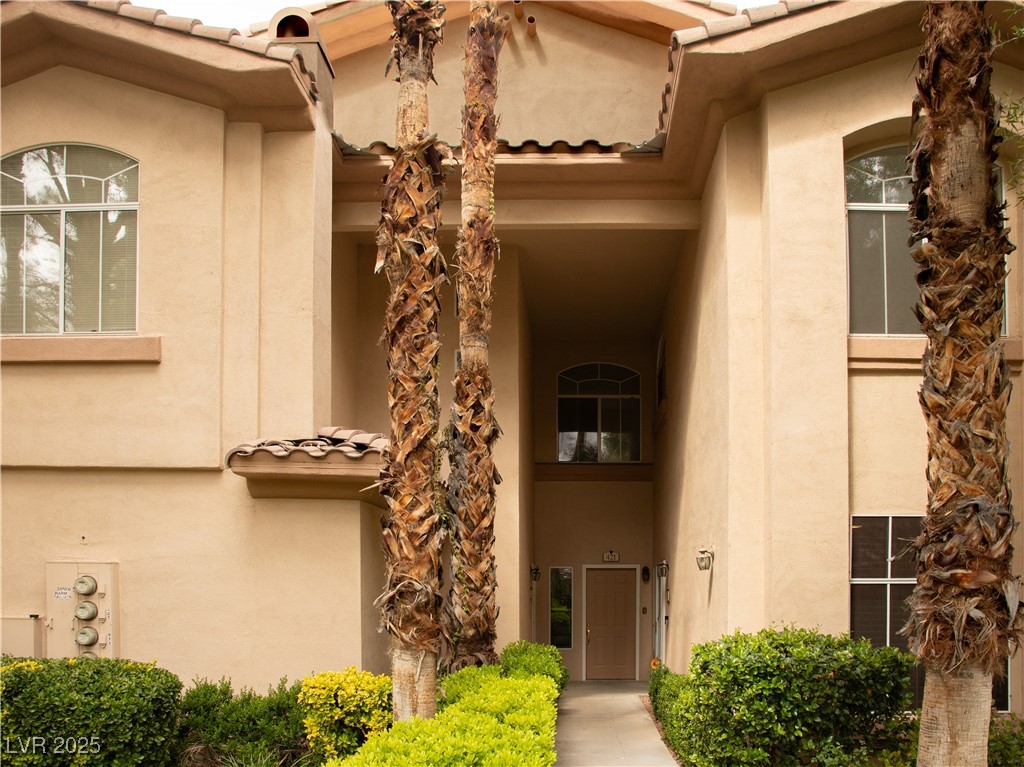 2050 West Warm Springs Road, Unit 411 Henderson, NV 89014 - Photo 29 of 30 Entrance to property with a tile roof and stucco siding