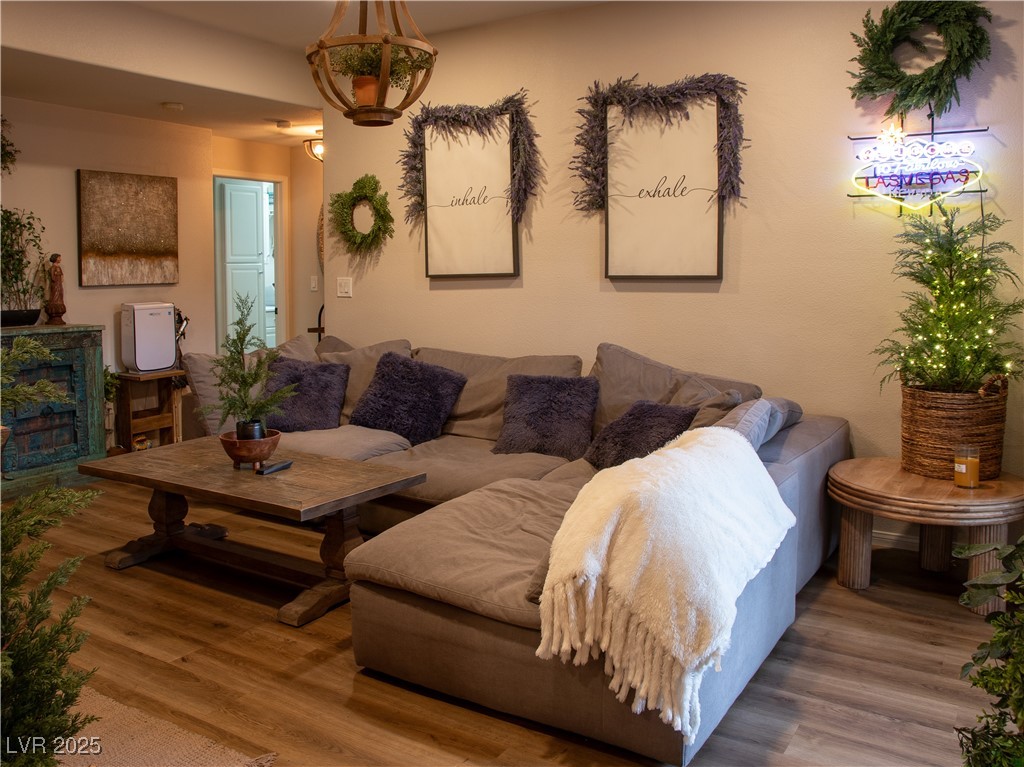 2050 West Warm Springs Road, Unit 411 Henderson, NV 89014 - Photo 7 of 30 Living room featuring wood finished floors