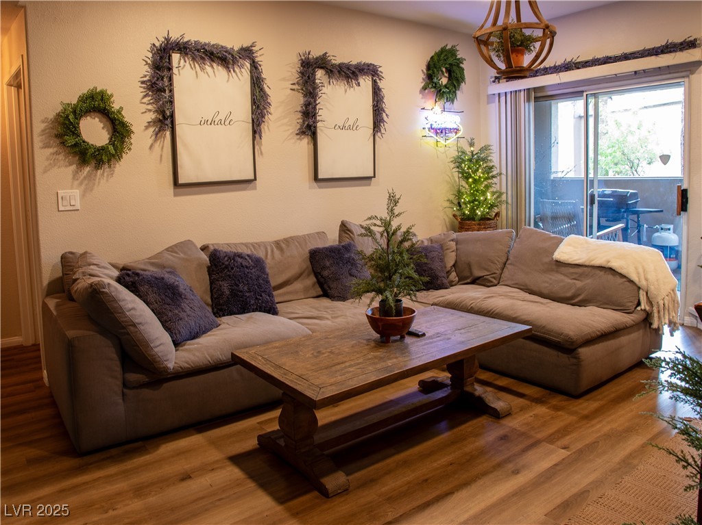 2050 West Warm Springs Road, Unit 411 Henderson, NV 89014 - Photo 9 of 30 Living room with wood finished floors
